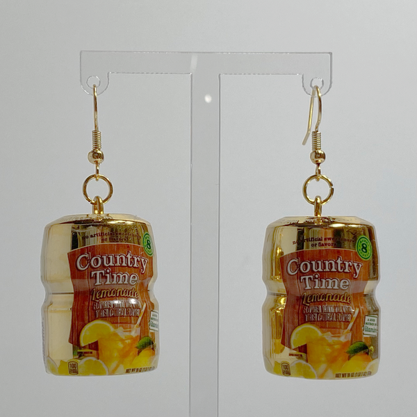 Mini gold Country Time lemonade mix earrings on a white backdrop.