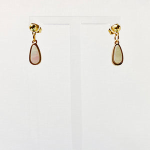 Gold studs with dangling marble teardrop charms.